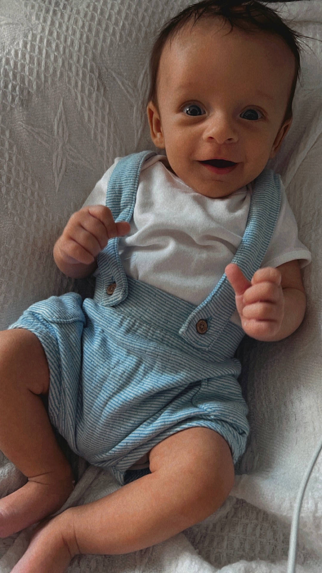 Oaklee-Levi joined the competition — help win amazing prizes! baby, bodypart, clothing, couch, face, finger, furniture, hand, happy, head, jeans, newborn, pants, person, photography, portrait, shorts, sitting, smile, t_shirt