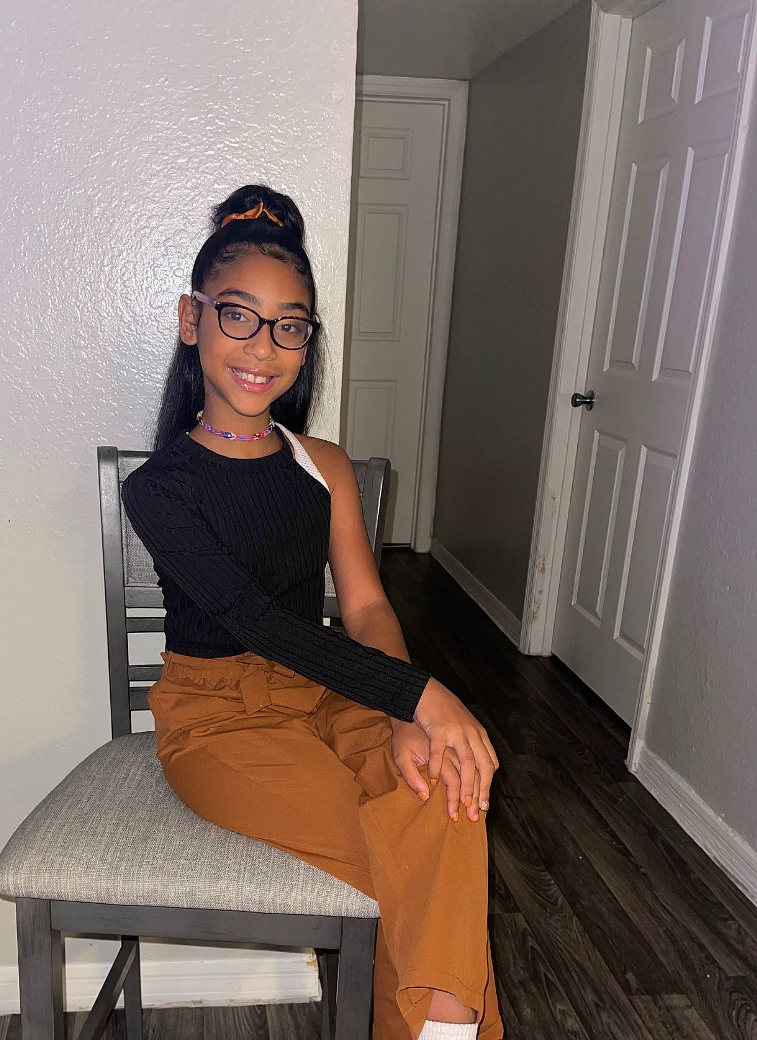 Naylani joined the competition — help win amazing prizes! black, black_hair, comfort, door, eyewear, fashion_design, flash_photography, hairstyle, joint, joy, knee, leg, neck, person, shoulder, sleeve, smile, standing, thigh, trunk