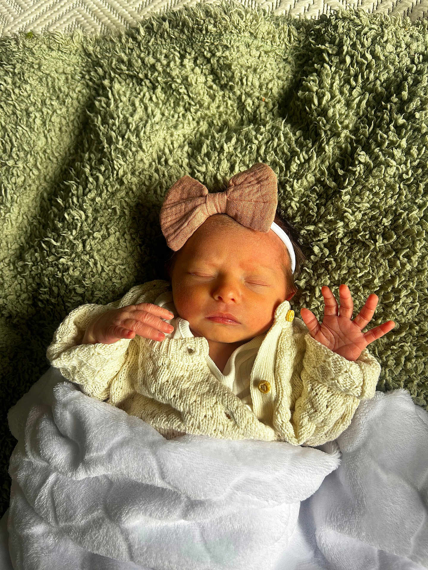 Orlagh joined the competition — help win amazing prizes! baby, newborn, sleeping, blanket, headband, bow, knitted_sweater, cozy, soft_texture, green_blanket, white_blanket, infant, peaceful, cute, portrait, hands, face, indoors, resting, child
