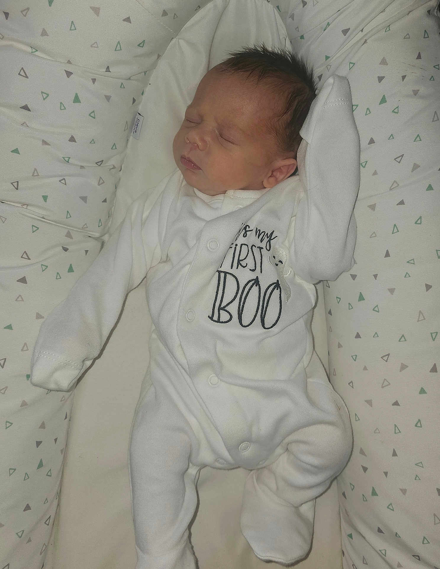 Auley joined the competition — help win amazing prizes! baby, bed, child, cushion, face, foot, hand, head, indoors, infant, newborn, onesie, pattern, peaceful, portrait, rest, sleeping, soft_fabric, triangles, white_clothing