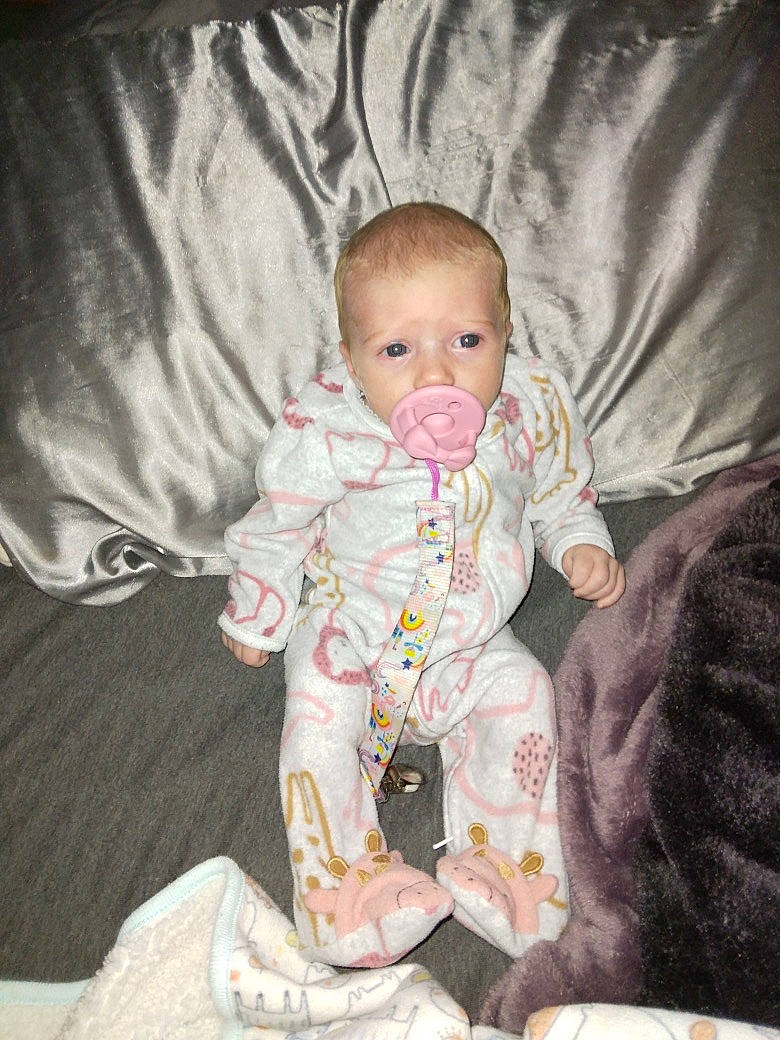 Adaleigh joined the competition — help win amazing prizes! baby, baby_toddler_clothing, cheek, child, comfort, flooring, foot, fun, lap, linens, nightwear, person, room, sitting, skin, sleeve, smile, sock, textile, toddler