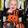 Wyatt joined the competition — help win amazing prizes! baby, black, car_seat, child, clothing, costume, cute, face, halloween, happy, indoors, infant, orange, person, plush_toy, portrait, pumpkin, seatbelt, smile, stripes
