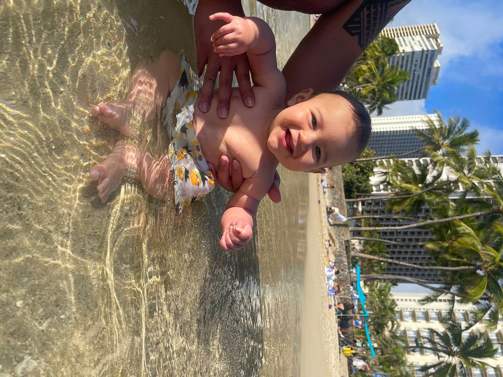 Zakai is registered to the contest to win money with this photo: child, city, fun, gesture, grass, happy, joy, leisure, liquid_bubble, people_in_nature, person, plant, play, recreation, sky, soil, swimwear, toddler, tree, vacation