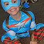 Ashtyn is registered to the contest to win money with this photo: barefoot, blue, brown, captain_america, carpet, cat, child, costume, cute, furniture, happy, indoor, mask, person, playful, red, room, sitting, smile, toy_truck