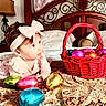 Maria Seraya is registered to the contest to win money with this photo: baby, child, pink_clothing, headband, bow, bed, bedspread, basket, easter_eggs, colorful, toy, indoor, curly_hair, patterned_fabric, wooden_headboard, lamp, pillow, furniture, portrait, cute