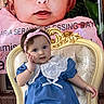 Maria Seraya joined the competition — help win amazing prizes! baby, child, blue_dress, white_lace, headband, chair, banner, portrait, cute, indoor, celebration, smile, person, face, hand, decor, event, text, background, sitting