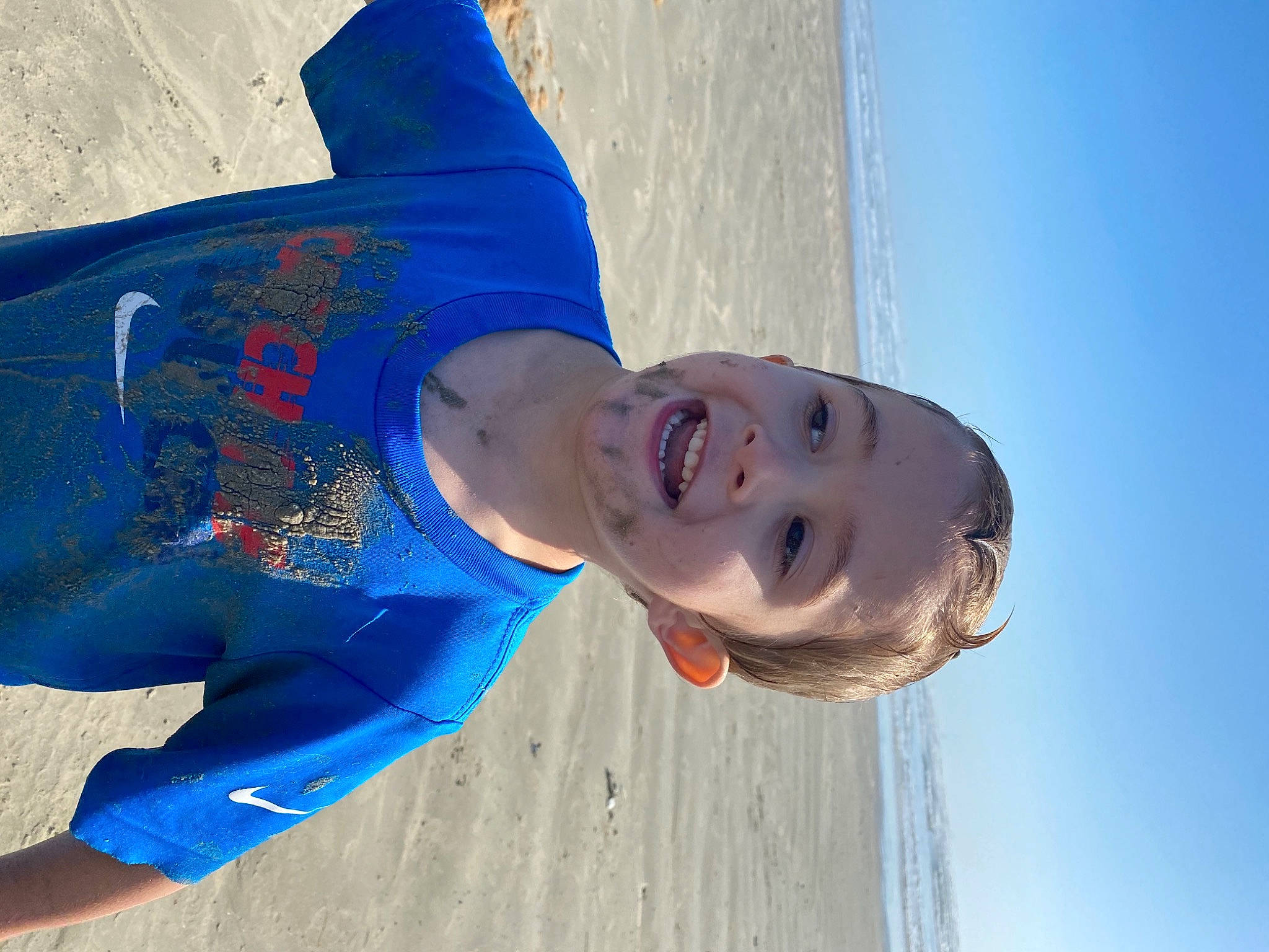 Jonah is registered to the contest to win money with this photo: beach, beauty, blue, body_of_water, chin, ear, facial_expression, forehead, fun, happy, leisure, light, mouth, nose, ocean, organ, people_in_nature, person, summer, sunlight