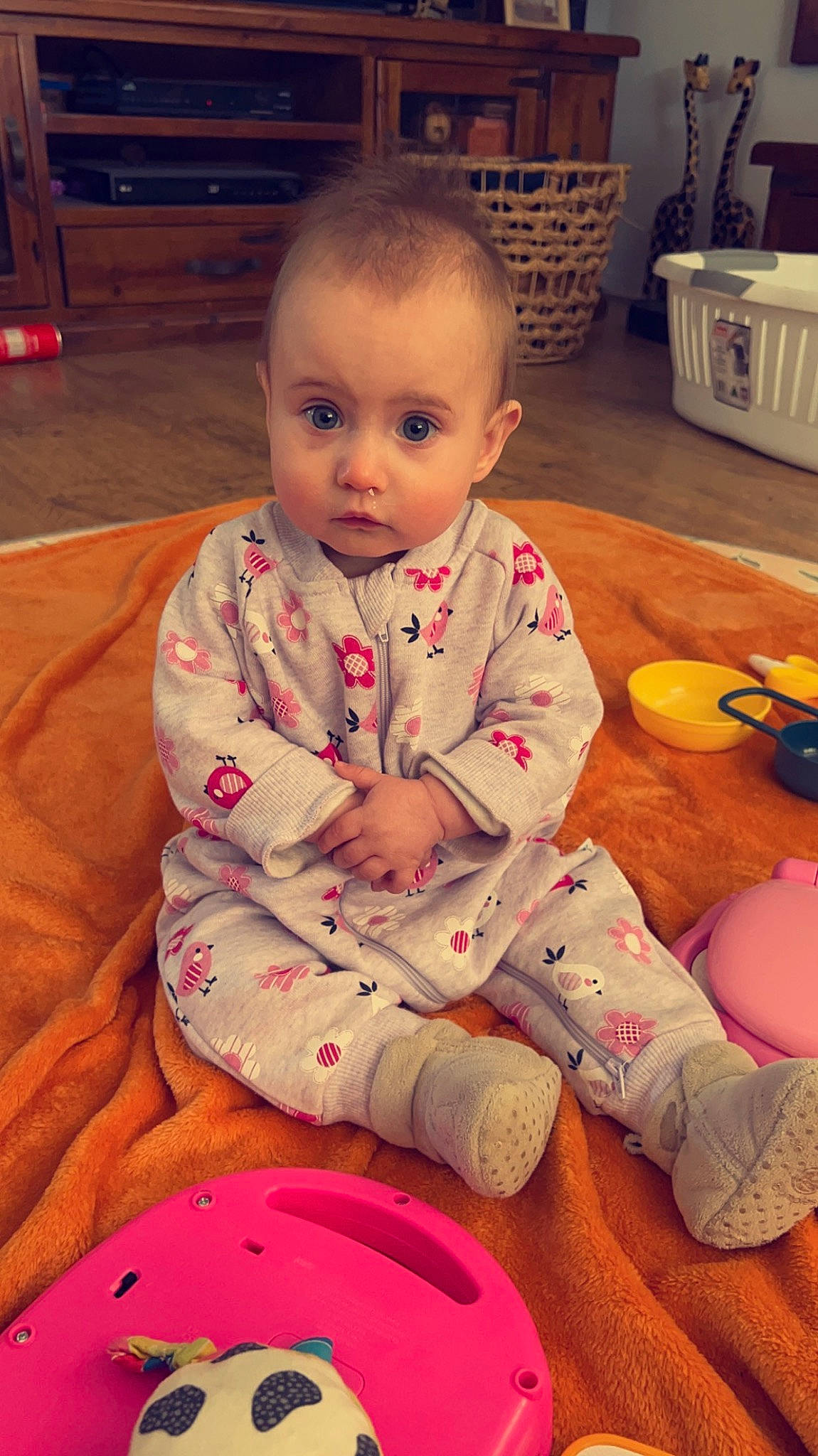 Lainey is registered to the contest to win money with this photo: baby, baby_toddler_clothing, cheek, child, comfort, eye, facial_expression, finger, floor, flooring, fun, happy, head, kitchen_appliance, nose, person, pink, skin, sleeve, toddler