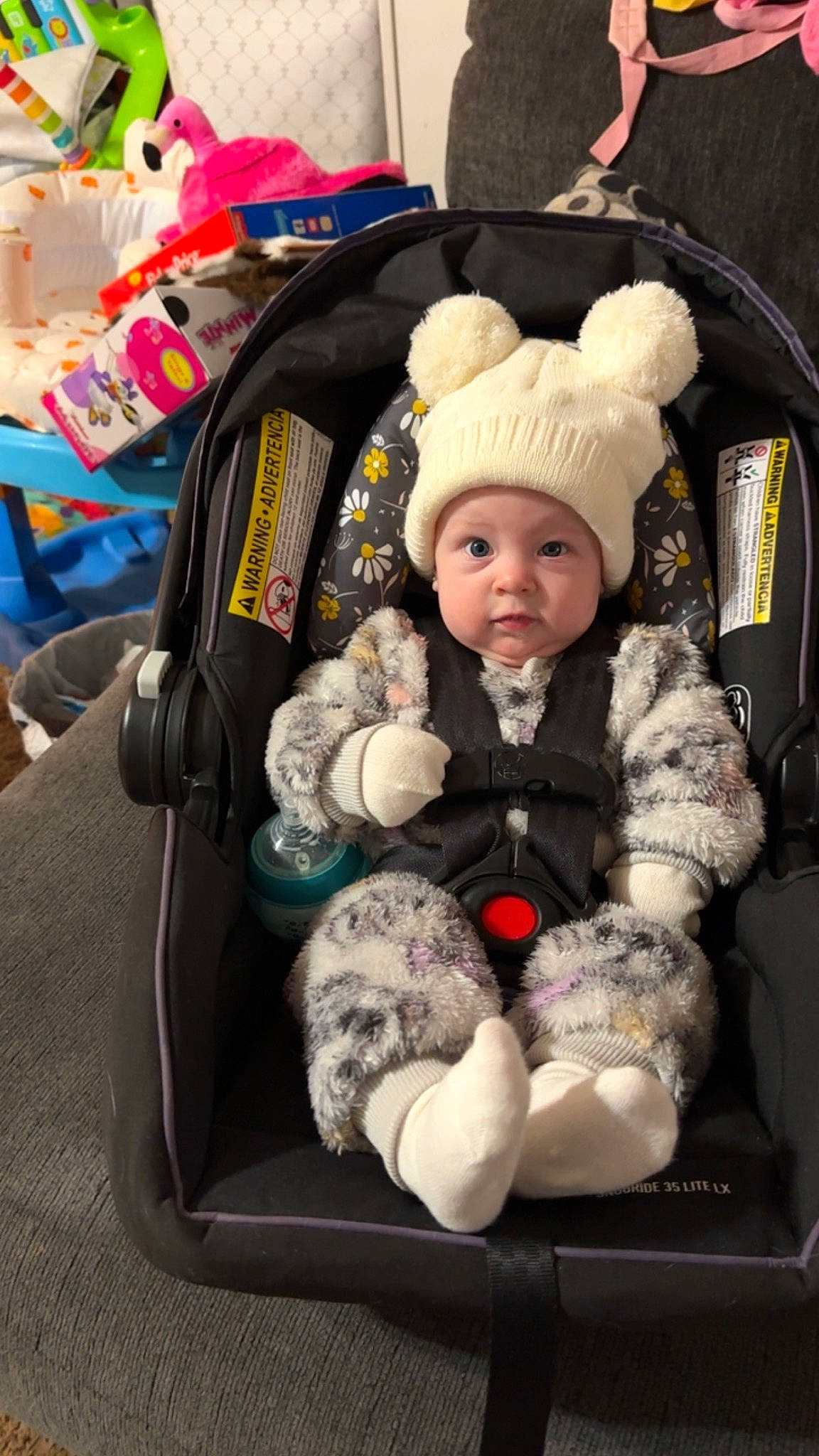 Parker is registered to the contest to win money with this photo: auto_part, baby, baby_carriage, baby_products, baby_toddler_clothing, beanie, car_seat, child, comfort, family_car, fun, fur, headwear, knit_cap, lap, motor_vehicle, person, seat_belt, sitting, toddler