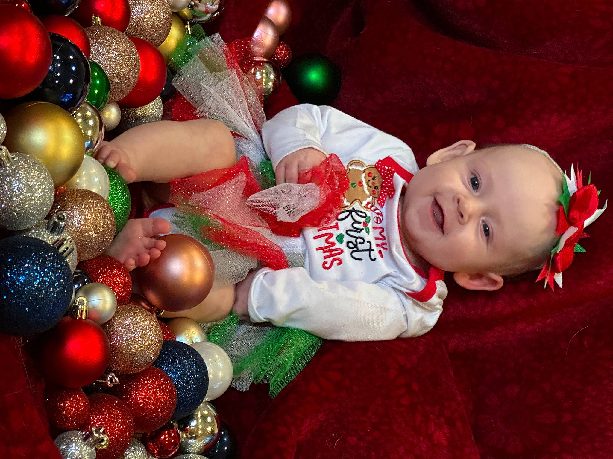 Parker joined the competition — help win amazing prizes! baby, baby_toddler_clothing, cheek, christmas, christmas_decoration, christmas_eve, christmas_ornament, christmas_tree, event, fictional_character, happy, holiday, holiday_ornament, joy, lap, mammal, ornament, person, smile, toddler