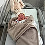 Maylon participe au concours pour gagner de l'argent avec cette photo : newborn, baby, blanket, bassinet, hospital, plush_toy, bunny, sleeping, infant, wrapped, soft, cute, child, hat, bed, comfort, rest, peaceful, indoor, person