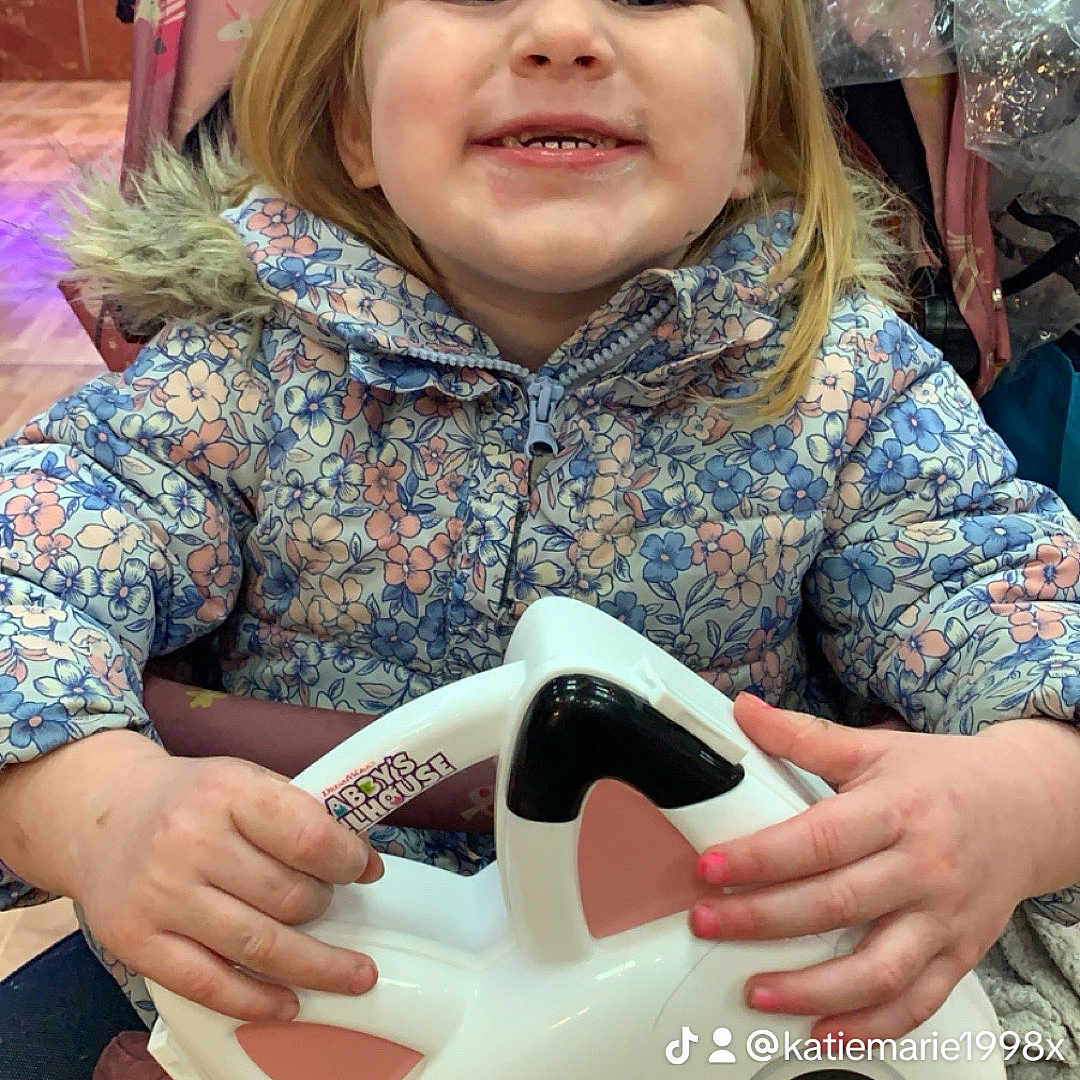 Olivia-Ann is registered to the contest to win money with this photo: ball, bodypart, child, clothing, coat, face, female, finger, football, girl, hand, head, helmet, jacket, person, photography, portrait, soccer, soccerball, sport