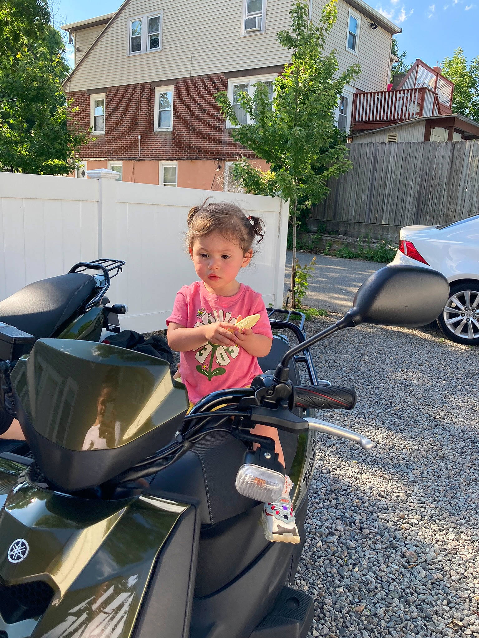 Skyler is registered to the contest to win money with this photo: automotive_design, automotive_exterior, automotive_lighting, automotive_tire, automotive_wheel_system, car, fender, house, land_vehicle, motor_vehicle, parking, person, plant, rim, sky, tire, toddler, tree, vehicle, wheel