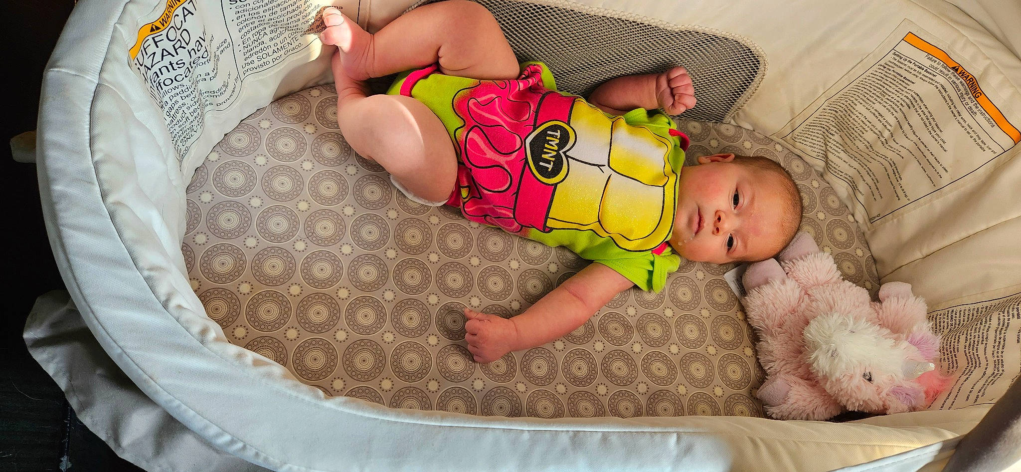 Makenna is registered to the contest to win money with this photo: abdomen, baby, baby_products, baby_sleeping, baby_toddler_clothing, brassiere, chest, comfort, foot, human_body, human_leg, leg, pattern, person, sitting, stomach, sunglasses, thigh, toddler, trunk