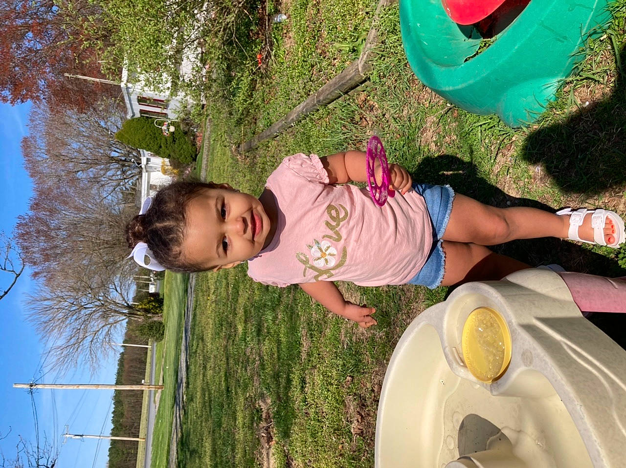 Amiya is registered to the contest to win money with this photo: baby, baby_toddler_clothing, fun, grass, green, happy, leisure, nature, people_in_nature, person, photograph, pink, plant, sky, snapshot, summer, toddler, tree, white, window