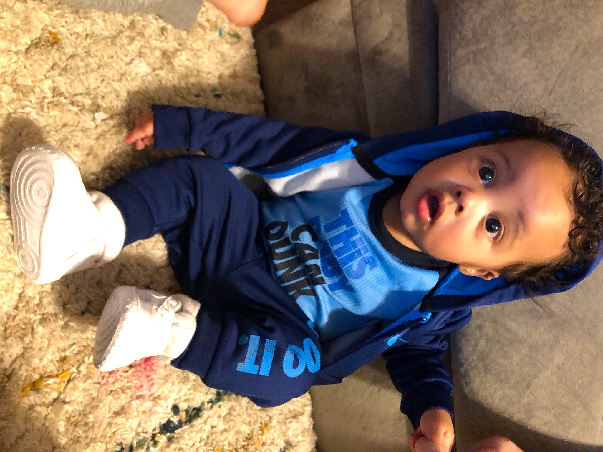 Jr is registered to the contest to win money with this photo: child, denim, electric_blue, eye, fun, grass, happy, head, human_leg, landscape, leisure, people_in_nature, person, play, rock, shadow, sitting, soil, surprise, t_shirt