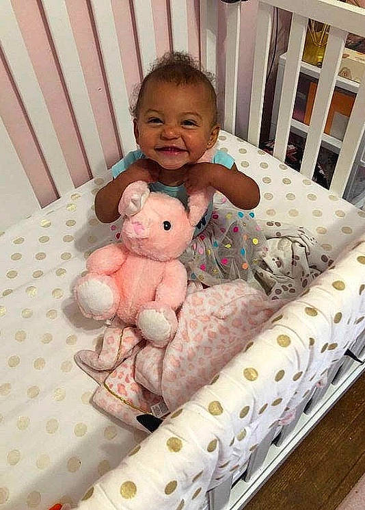 Jayde is registered to the contest to win money with this photo: baby, baby_products, baby_safety, baby_toys, bed, bedding, child, cradle, furniture, infant_bed, joy, nursery, person, pink, product, room, skin, stuffed_toy, teddy_bear, textile