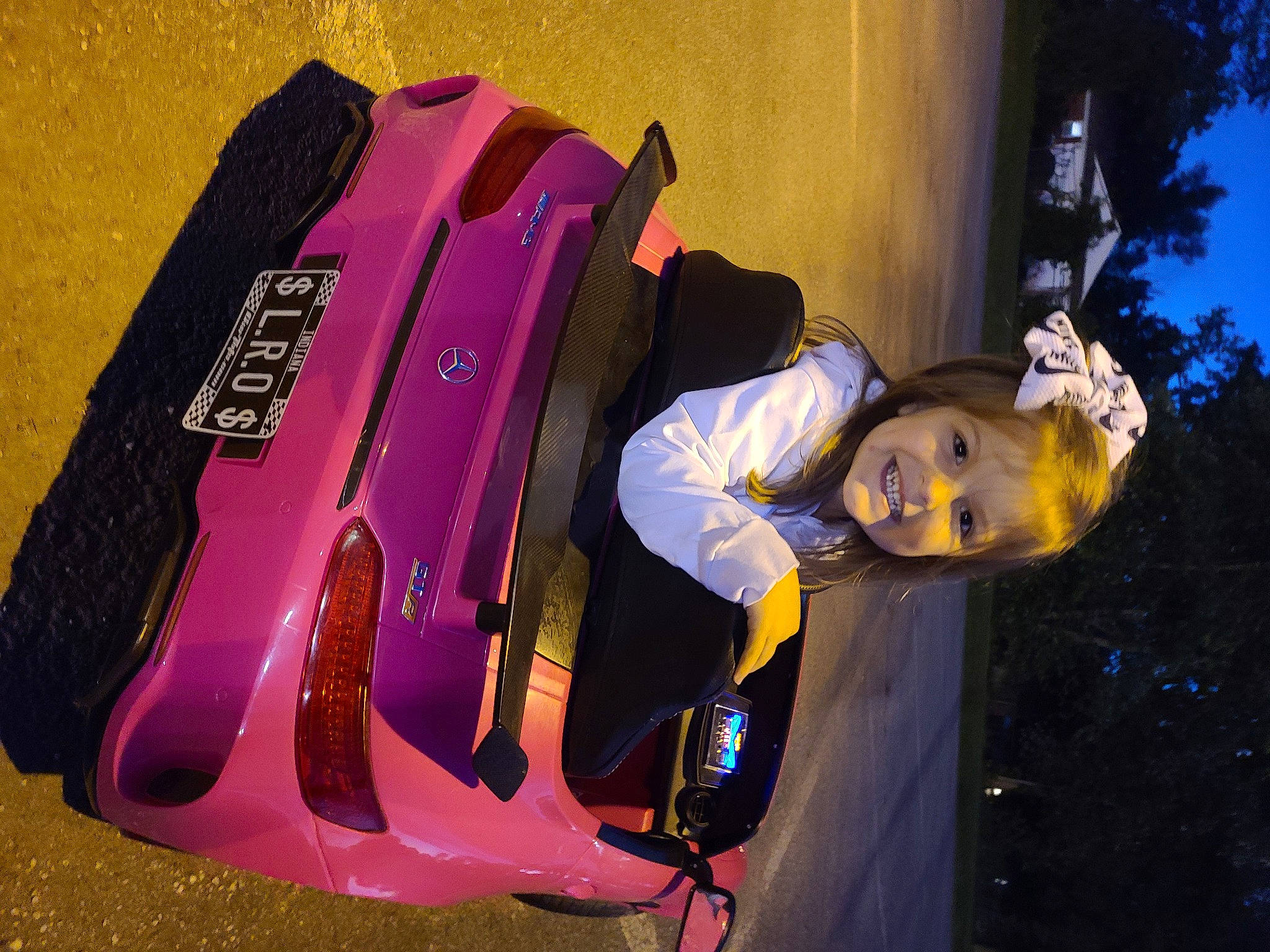 Lorelei is registered to the contest to win money with this photo: automotive_design, automotive_exterior, automotive_lighting, automotive_tire, bumper, electric_blue, entertainment, fashion, fender, helmet, joy, magenta, motor_vehicle, music, musical_instrument, person, plant, purple, tire, tree