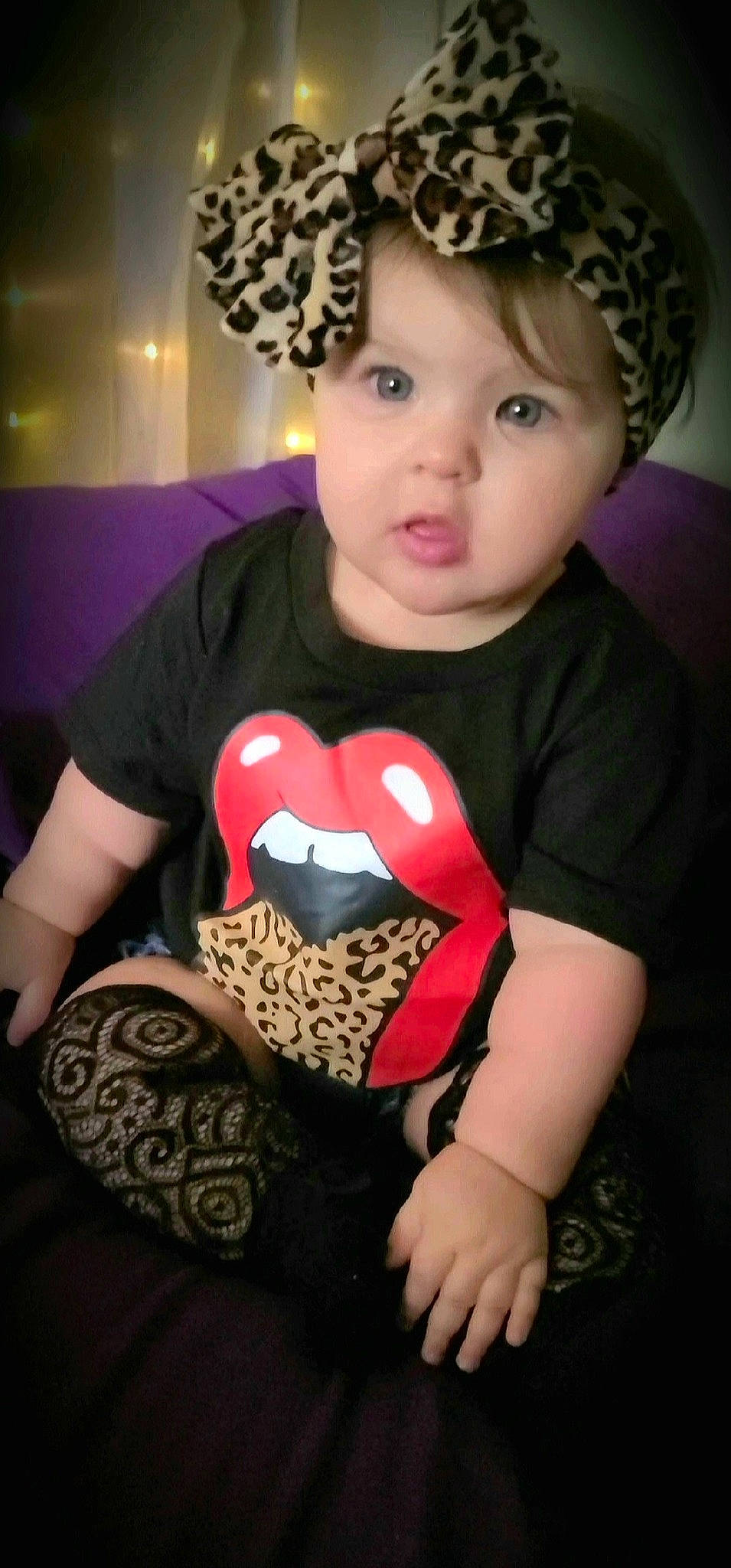 Leia is registered to the contest to win money with this photo: arm, baby_toddler_clothing, black, cool, costume_hat, eye, facial_expression, flash_photography, fun, hairstyle, happy, hat, head, headwear, neck, organ, pattern, person, pink, sleeve