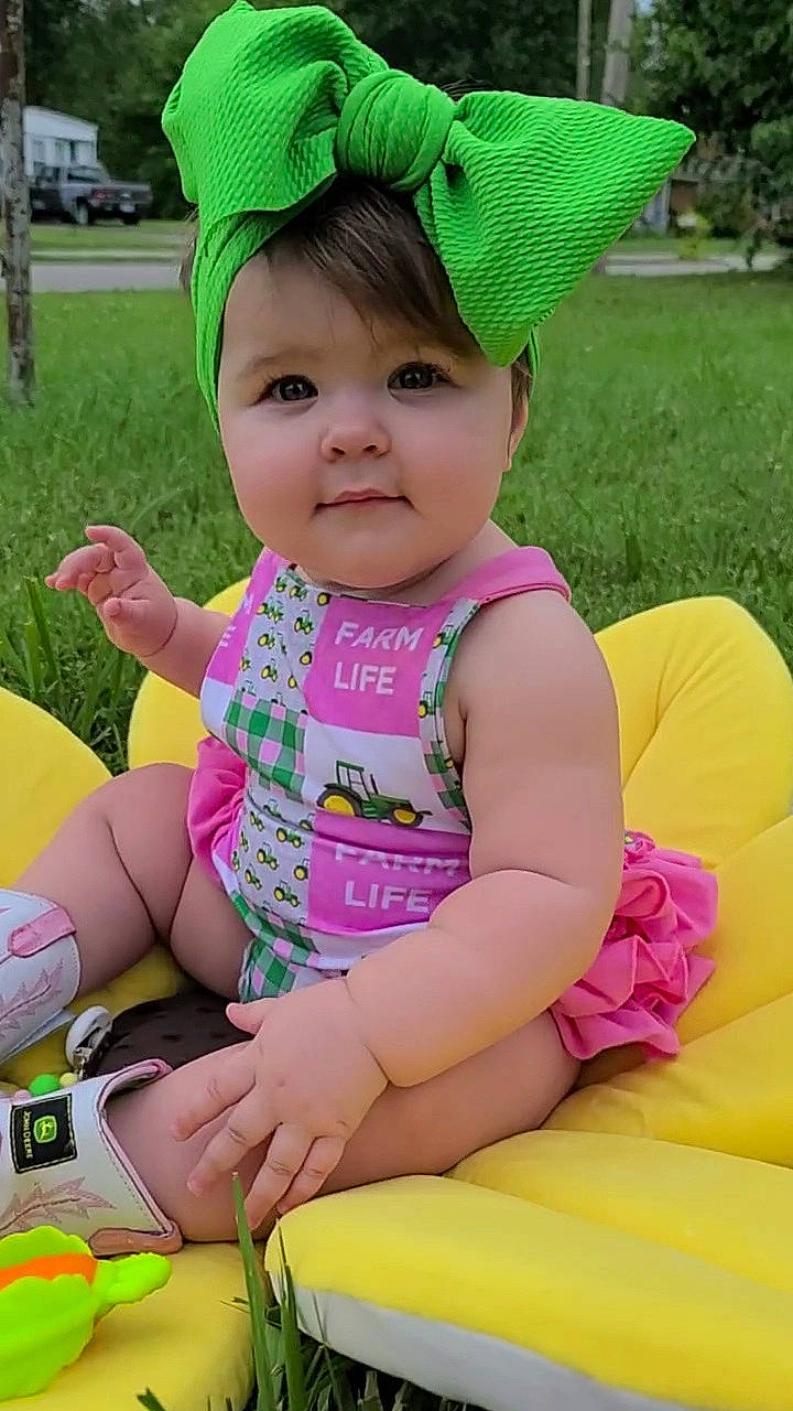 Leia joined the competition — help win amazing prizes! baby, baby_toddler_clothing, cap, facial_expression, fun, grass, green, happy, leisure, magenta, people_in_nature, person, photograph, pink, plant, product, purple, skin, smile, toddler