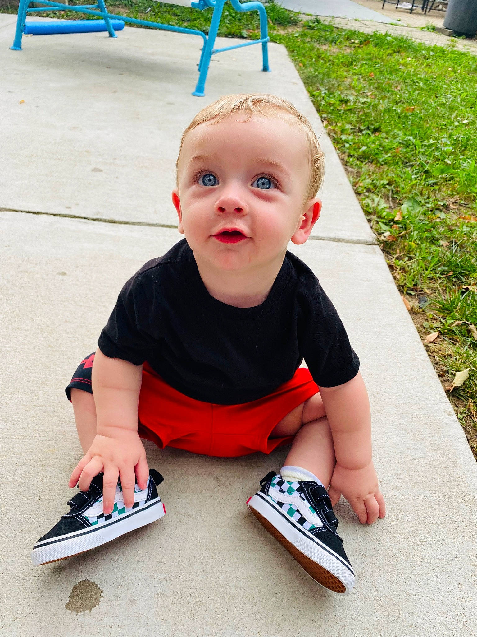 Maverick is registered to the contest to win money with this photo: baby, baby_toddler_clothing, carmine, child, eye, flooring, fun, grass, happy, leisure, person, plant, play, recreation, sitting, sleeve, smile, t_shirt, toddler, toy