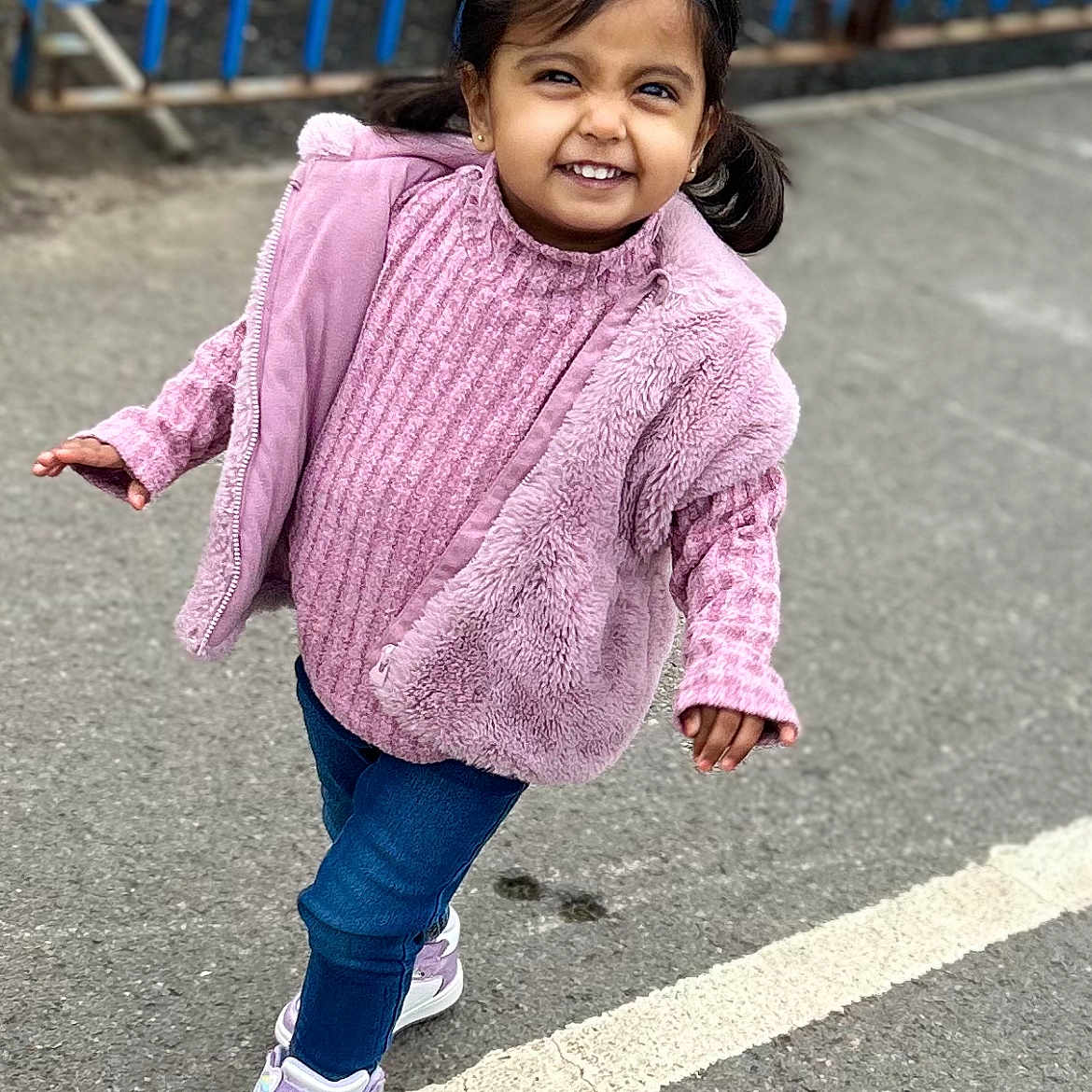 Naaz joined the competition — help win amazing prizes! blackhair, child, clothing, coat, face, female, girl, hair, happy, head, hoodie, jeans, knitwear, pants, pedestrian, person, sleeve, smile, sweater, sweatshirt