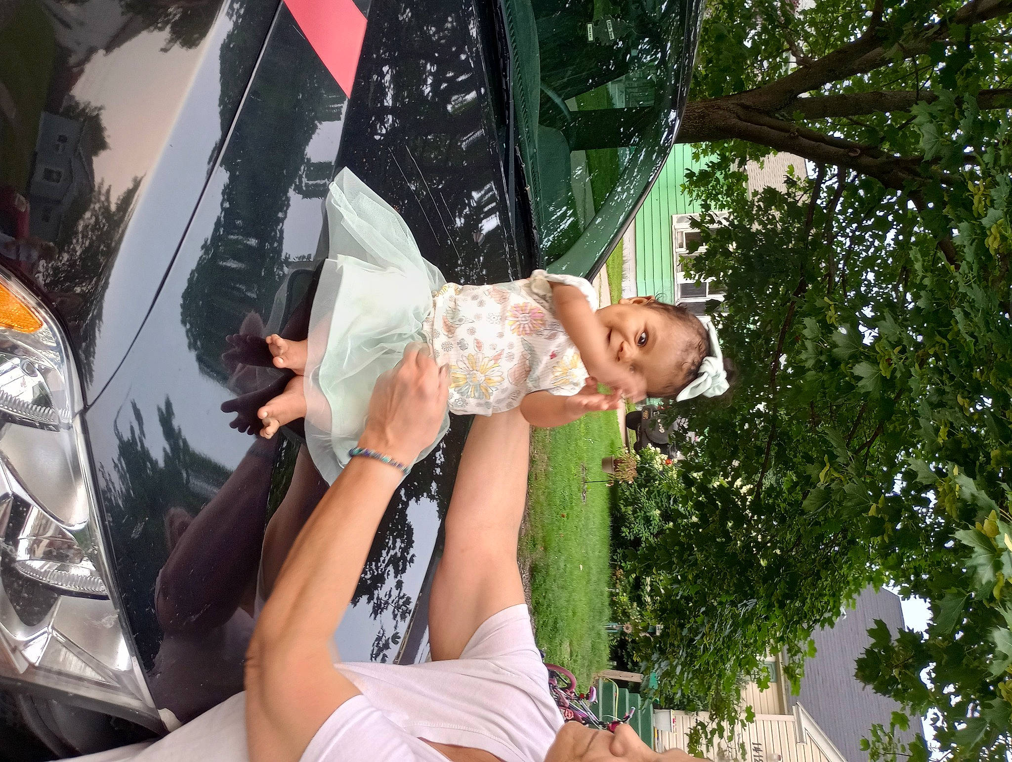 Jasmine joined the competition — help win amazing prizes! automotive_design, automotive_exterior, automotive_lighting, bumper, car, event, family_car, grass, happy, headlamp, hood, human_leg, leisure, mid_size_car, motor_vehicle, person, personal_luxury_car, shorts, thigh, tree