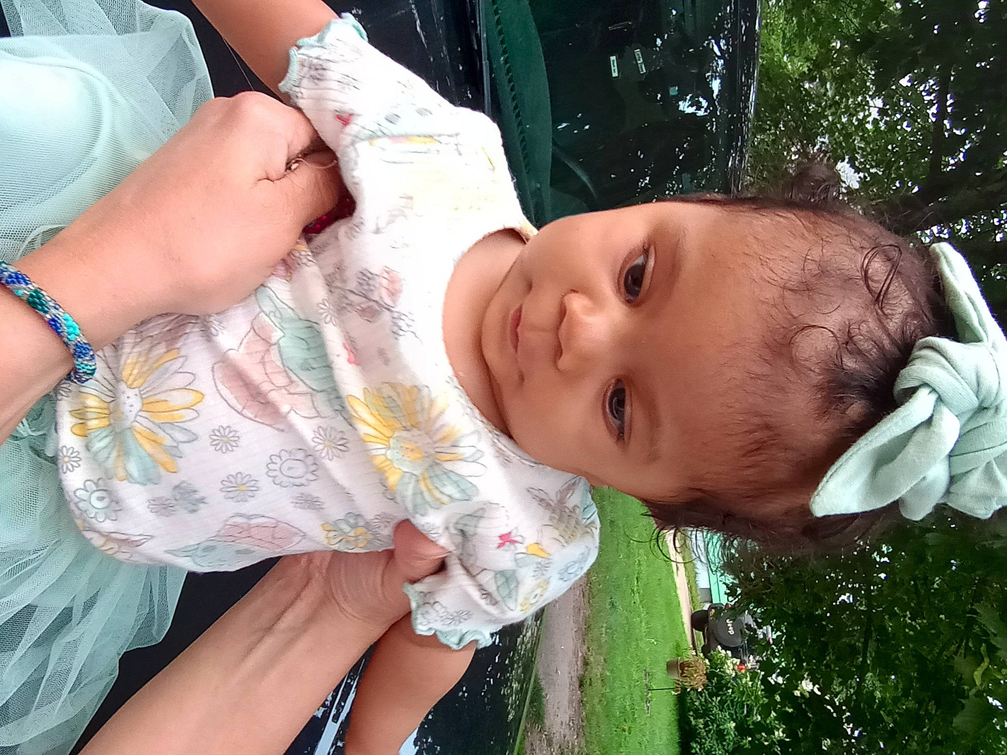 Jasmine is registered to the contest to win money with this photo: adaptation, child, finger, fun, gesture, grass, green, hand, happy, leisure, neck, nose, organ, people_in_nature, person, plant, skin, smile, thumb, toddler