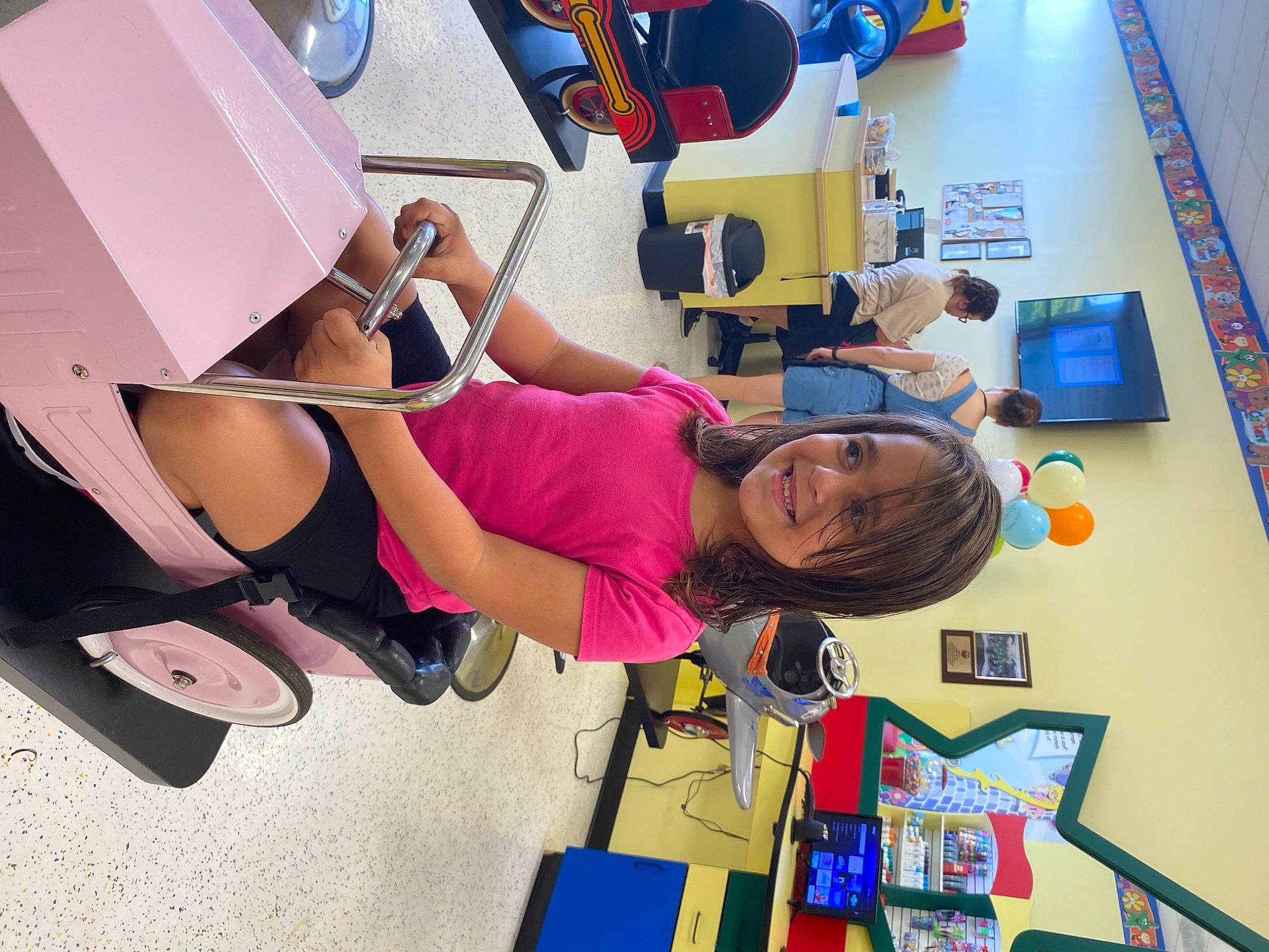 Jazlyn joined the competition — help win amazing prizes! art, automotive_design, child, eyewear, fun, hat, human_leg, illustration, joy, leisure, luggage_and_bags, person, play, room, sandal, smile, sneakers, textile, thigh, tire