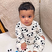 Mohan joined the competition — help win amazing prizes! baby, bare_feet, blanket, child, closeup, colorful_toy, cushions, cute, dark_hair, furniture, indoor, infant, nursery, pajamas, panda_pajamas, portrait, sitting, smiling, toy, wide_eyed