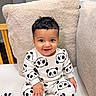 Mohan is registered to the contest to win money with this photo: baby, chair, child, clothing, cushion, face, furniture, hair, happy, home, indoor, infant, pajamas, panda, photography, playroom, portrait, sitting, smiling, toy
