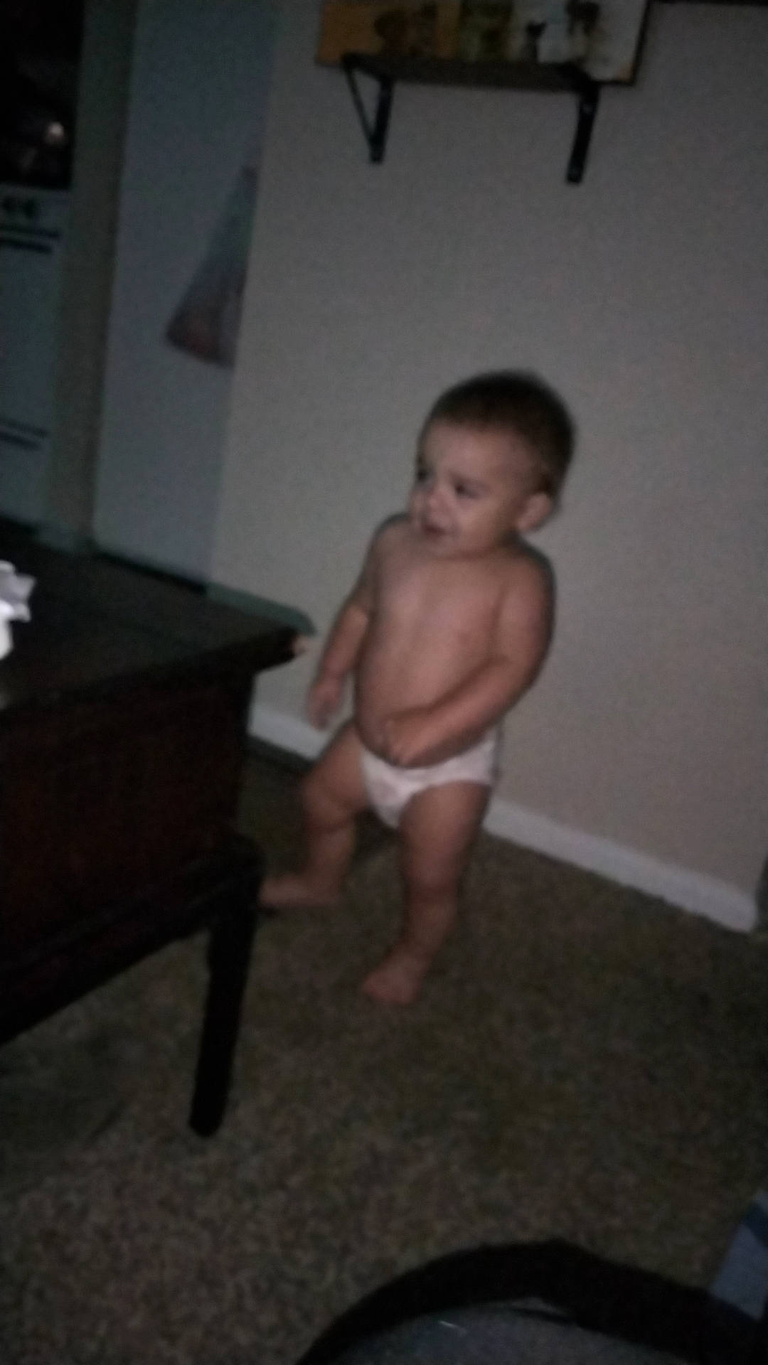 Bentley is registered to the contest to win money with this photo: abdomen, arm, barechested, barefoot, chest, child, elbow, finger, flooring, foot, hand, hardwood, human_leg, knee, person, room, thigh, thumb, toddler, trunk