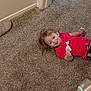 Aspen is registered to the contest to win money with this photo: baby_bottle, candid, carpet, casual, child, cute, floor, home, indoor, pacifier, person, playful, red_shirt, slipper, smiling, stroller, toddler, tongue_out, toy, young_child