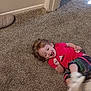 adidas, candid, carpet, child, colorful_pants, doorframe, expression, floor, footwear, happy, home, indoor, laughing, person, playful, red_shirt, smiling, toddler, wall, young_child