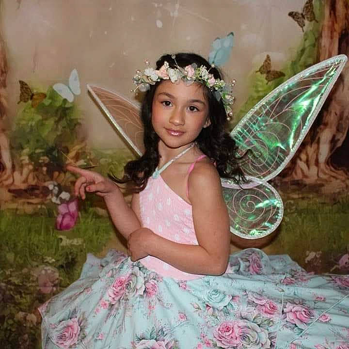 Christiana joined the competition — help win amazing prizes! beauty, bridal_accessory, dress, facial_expression, feather, flash_photography, fun, grass, green, hairstyle, happy, headpiece, headwear, iris, jewellery, joy, mythical_creature, organ, person, pink