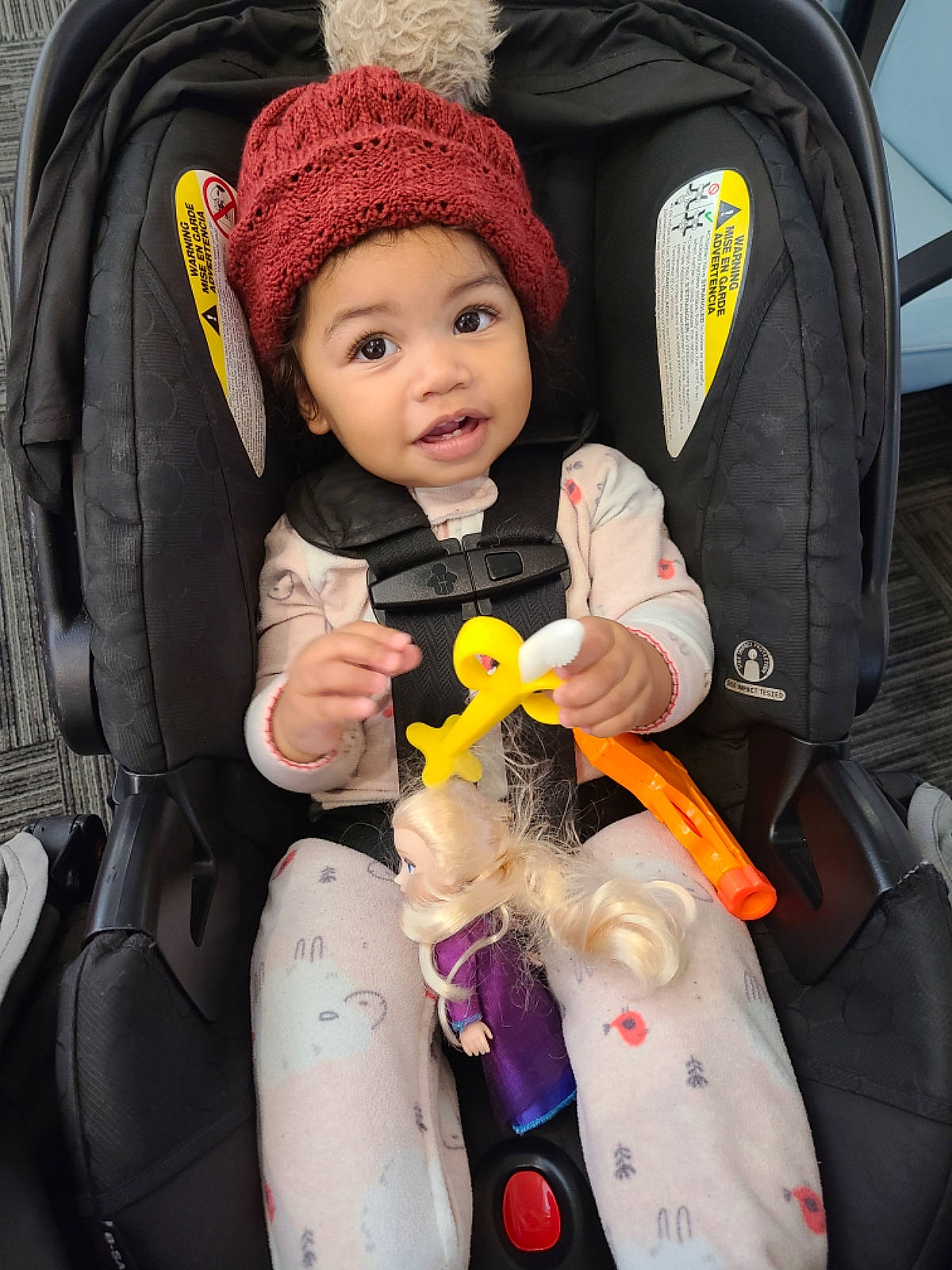 Naiomi joined the competition — help win amazing prizes! baby, baby_carriage, baby_products, baby_toddler_clothing, beanie, cap, car_seat, cheek, child, comfort, fun, fur, headwear, knit_cap, lap, outerwear, person, personal_protective_equipment, sitting, skin
