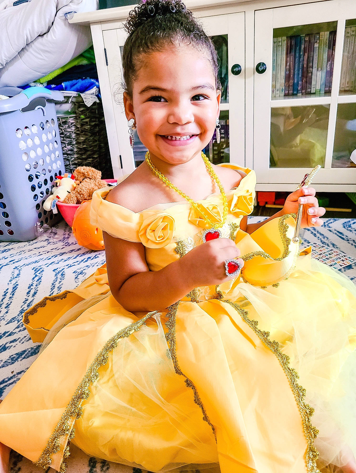 Amayah is registered to the contest to win money with this photo: child, costume, costume_design, dress, event, fashion, fashion_design, formal_wear, fun, hairstyle, happy, jewellery, joy, leisure, necklace, peach, person, room, ruffle, sitting