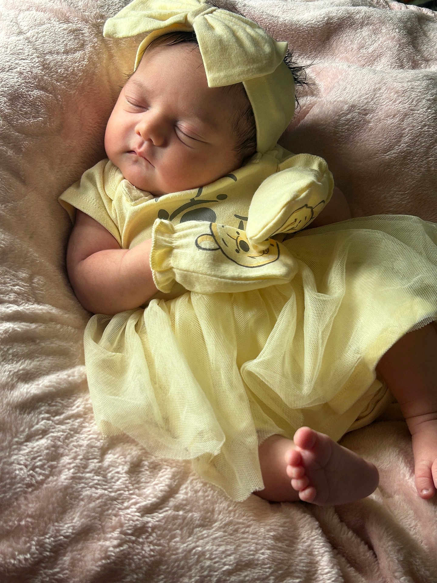Elianna joined the competition — help win amazing prizes! baby, sleeping, yellow_clothing, headband, mittens, blanket, soft_texture, infant, peaceful, cute, newborn, portrait, indoors, tulle_skirt, foot, hand, resting, cozy, child, adorable