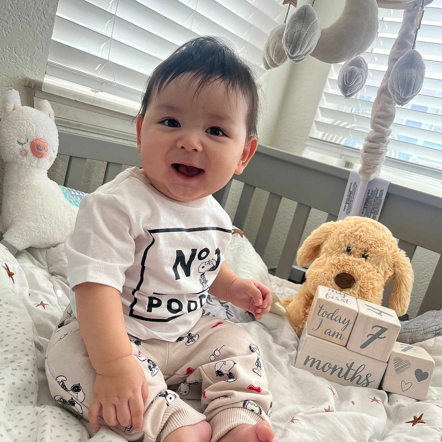 Noah joined the competition — help win amazing prizes! baby, bed, bedroom, clothing, crib, cushion, face, furniture, happy, head, homedecor, indoors, infantbed, person, photography, portrait, room, sitting, t_shirt, toy