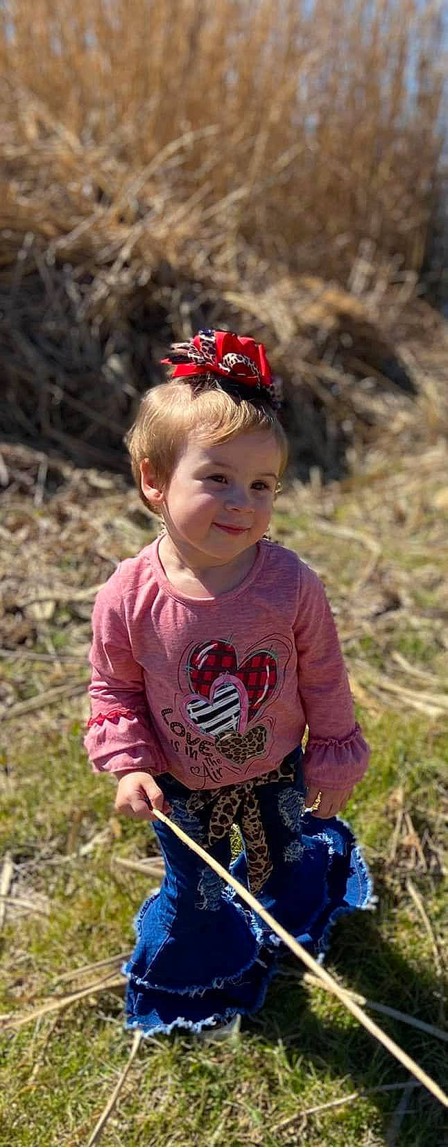 Peyton is registered to the contest to win money with this photo: cap, child, cycle_sport, eye, face, fashion_accessory, fun, grass, happy, jeans, joy, landscape, people_in_nature, person, personal_protective_equipment, plant, recreation, smile, soil, sunglasses