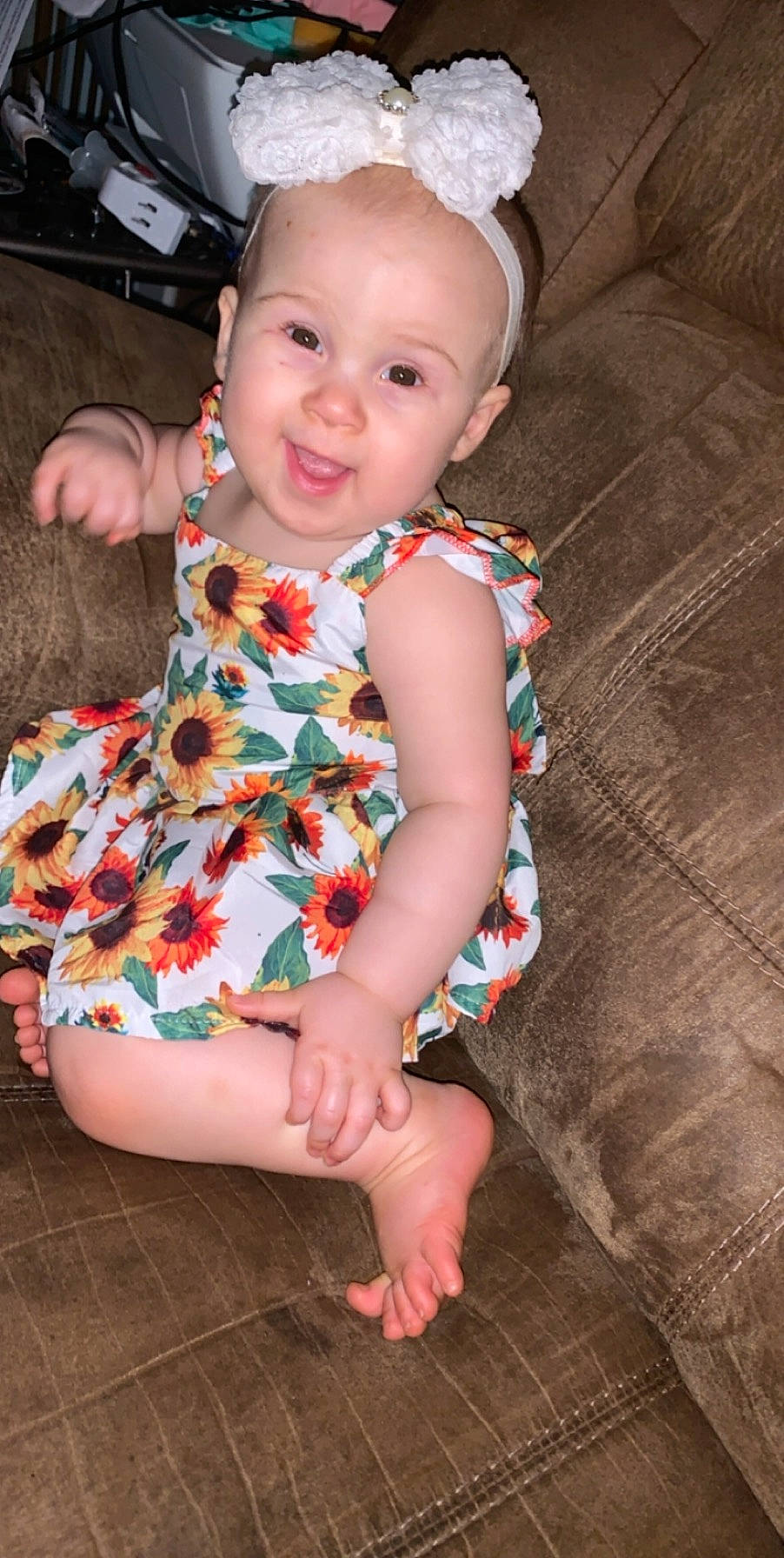Peyton is registered to the contest to win money with this photo: baby, baby_toddler_clothing, child, dress, leg, pattern, person, sitting, skin, toddler