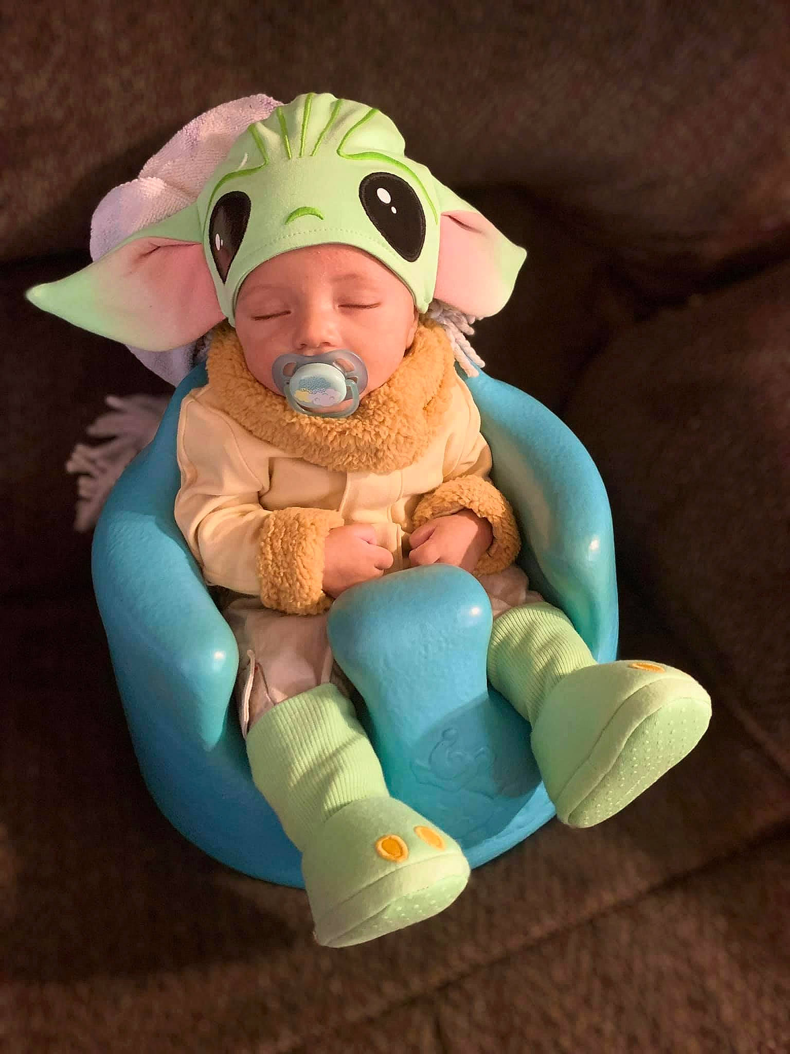 Lamar is registered to the contest to win money with this photo: amphibian, baby, baby_products, baby_safety, baby_toddler_clothing, baby_toys, comfort, fictional_character, finger, fun, headwear, linens, person, personal_protective_equipment, plush, recreation, sitting, sleeve, stuffed_toy, suidae