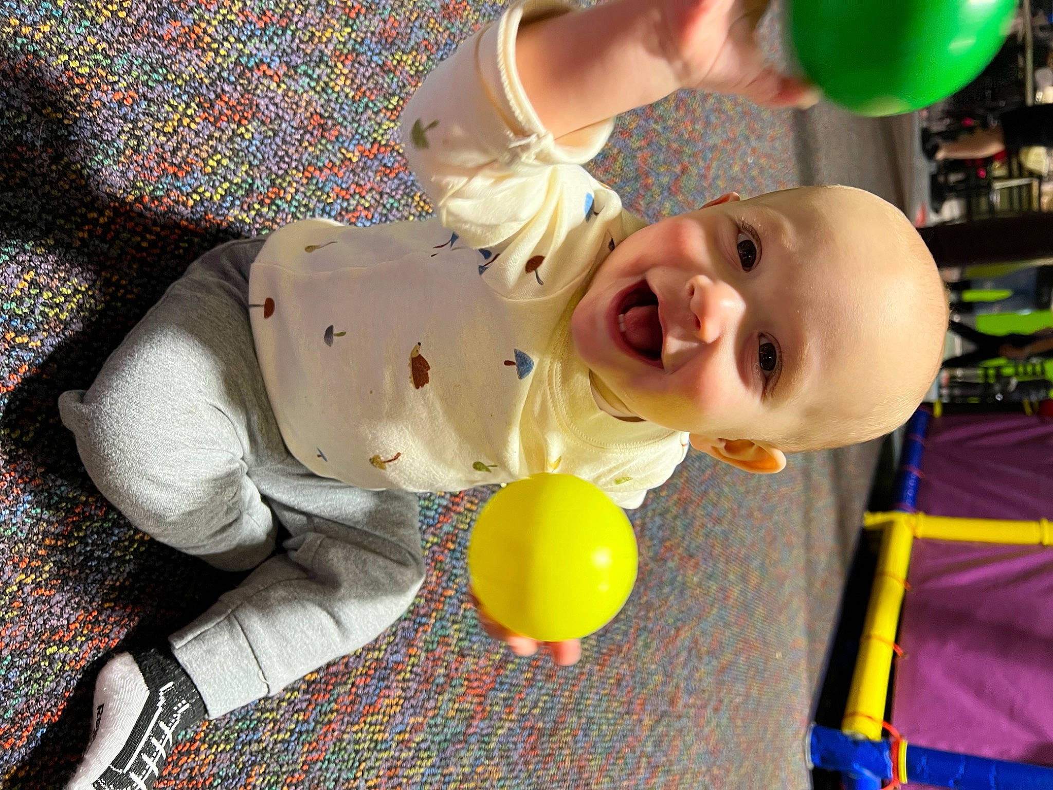 Ezra is registered to the contest to win money with this photo: baby, baby_laughing, baby_products, baby_toddler_clothing, baby_toys, balloon, child, event, fun, happy, laugh, leisure, party_supply, pattern, person, photograph, play, smile, toddler, toy