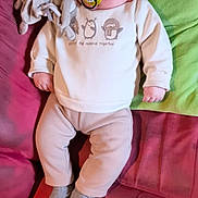 Ayden participe au concours pour gagner de l'argent avec cette photo : baby, sleeping, pacifier, plush_toy, blanket, couch, clothing, socks, infant, rest, comfort, soft, indoors, cute, child, relaxation, portrait, small_person, peaceful, home