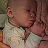 Audrey is registered to the contest to win money with this photo: baby, sleeping, blanket, hand, infant, soft, cozy, person, bedtime, pajamas, newborn, cute, comfort, rest, peaceful, child, skin, face, toddler, nap