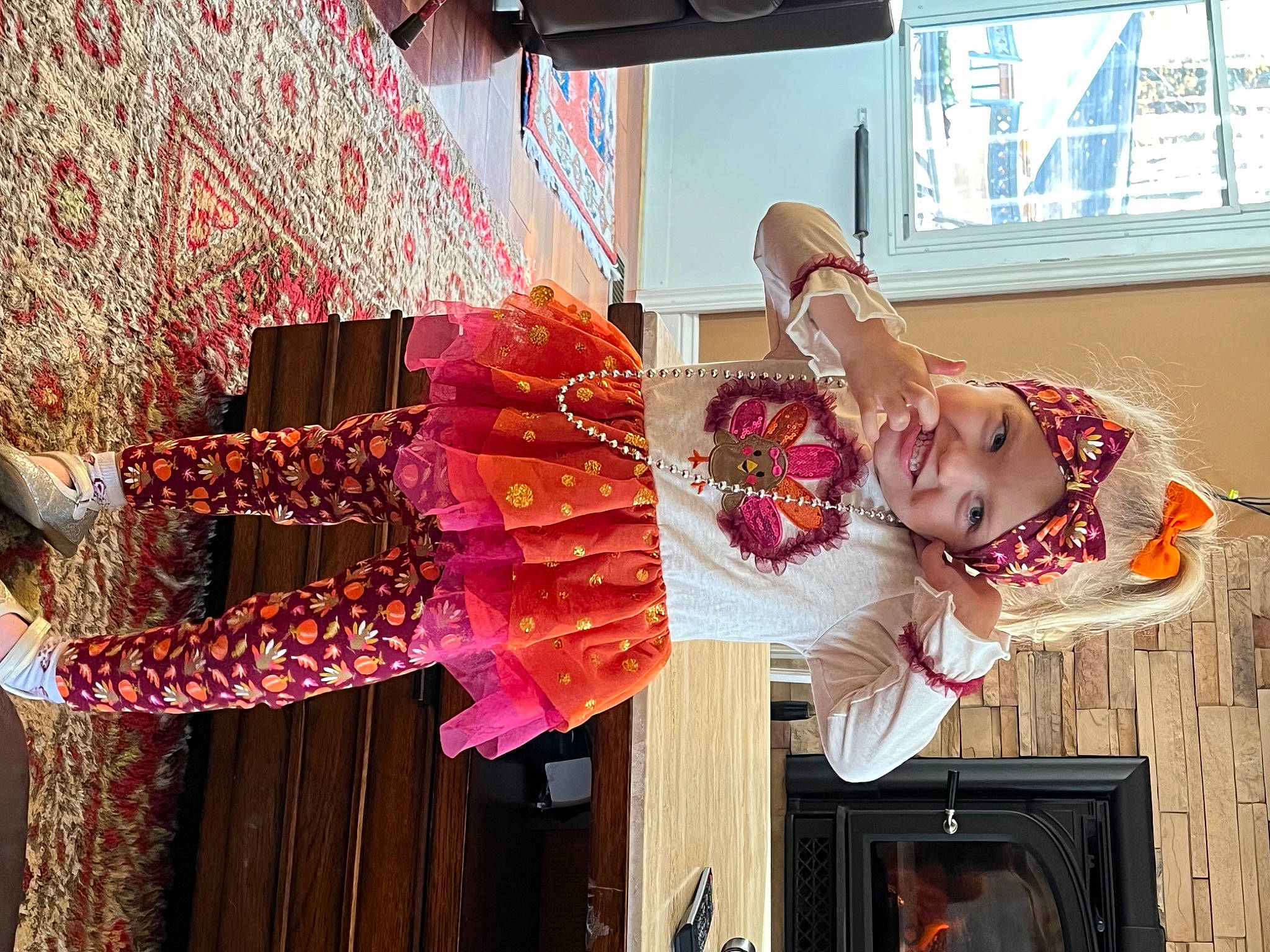 Lilly is registered to the contest to win money with this photo: costume, dress, entertainment, event, fashion_design, flesh, fun, happy, headwear, joy, magenta, orange, peach, person, pink, red, room, smile, snapshot, textile