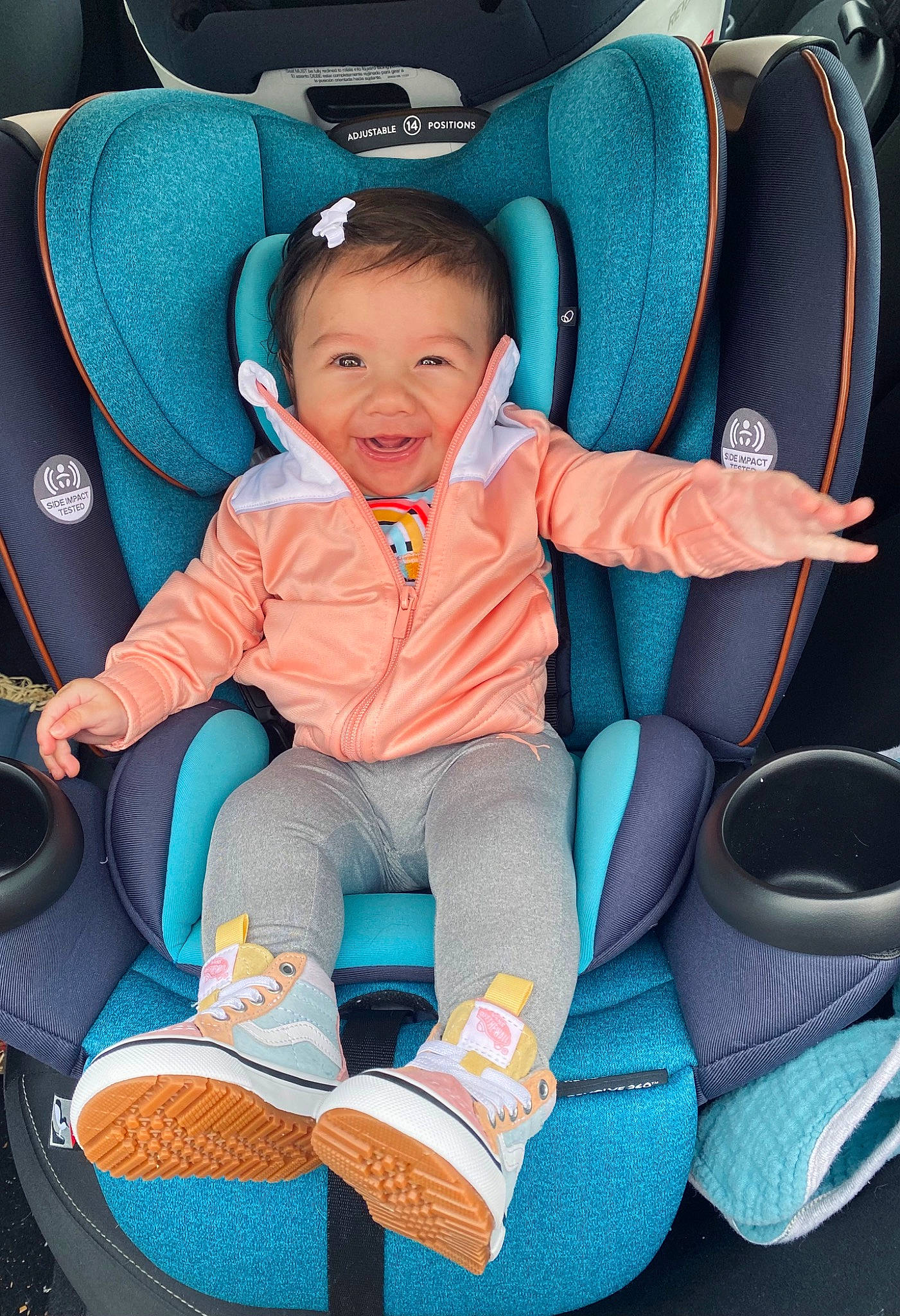 Olivia is registered to the contest to win money with this photo: auto_part, automotive_design, baby_carriage, baby_products, blue, car, car_seat, comfort, electric_blue, fun, green, motor_vehicle, person, purple, smile, sneakers, steering_wheel, toddler, vehicle, wheel
