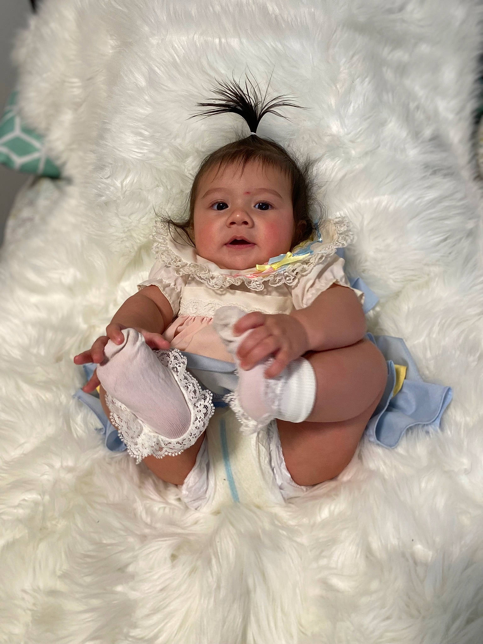 Olivia is registered to the contest to win money with this photo: baby, baby_sleeping, baby_toddler_clothing, comfort, costume, embellishment, eye, fashion_accessory, flash_photography, fun, fur, happy, headgear, headpiece, iris, jewellery, linens, person, ruffle, sitting