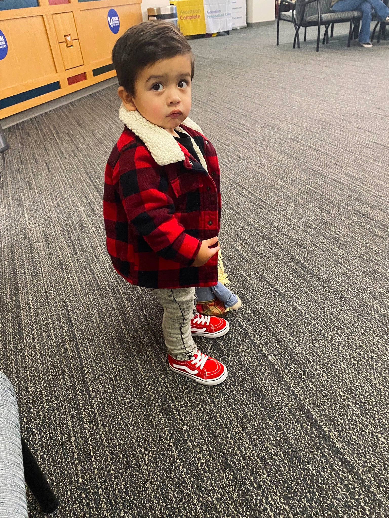 Marcel is registered to the contest to win money with this photo: child, electric_blue, floor, flooring, fun, human_leg, knee, person, plaid, plant, product, shorts, sleeve, sock, sportswear, standing, tartan, thigh, toddler, tree