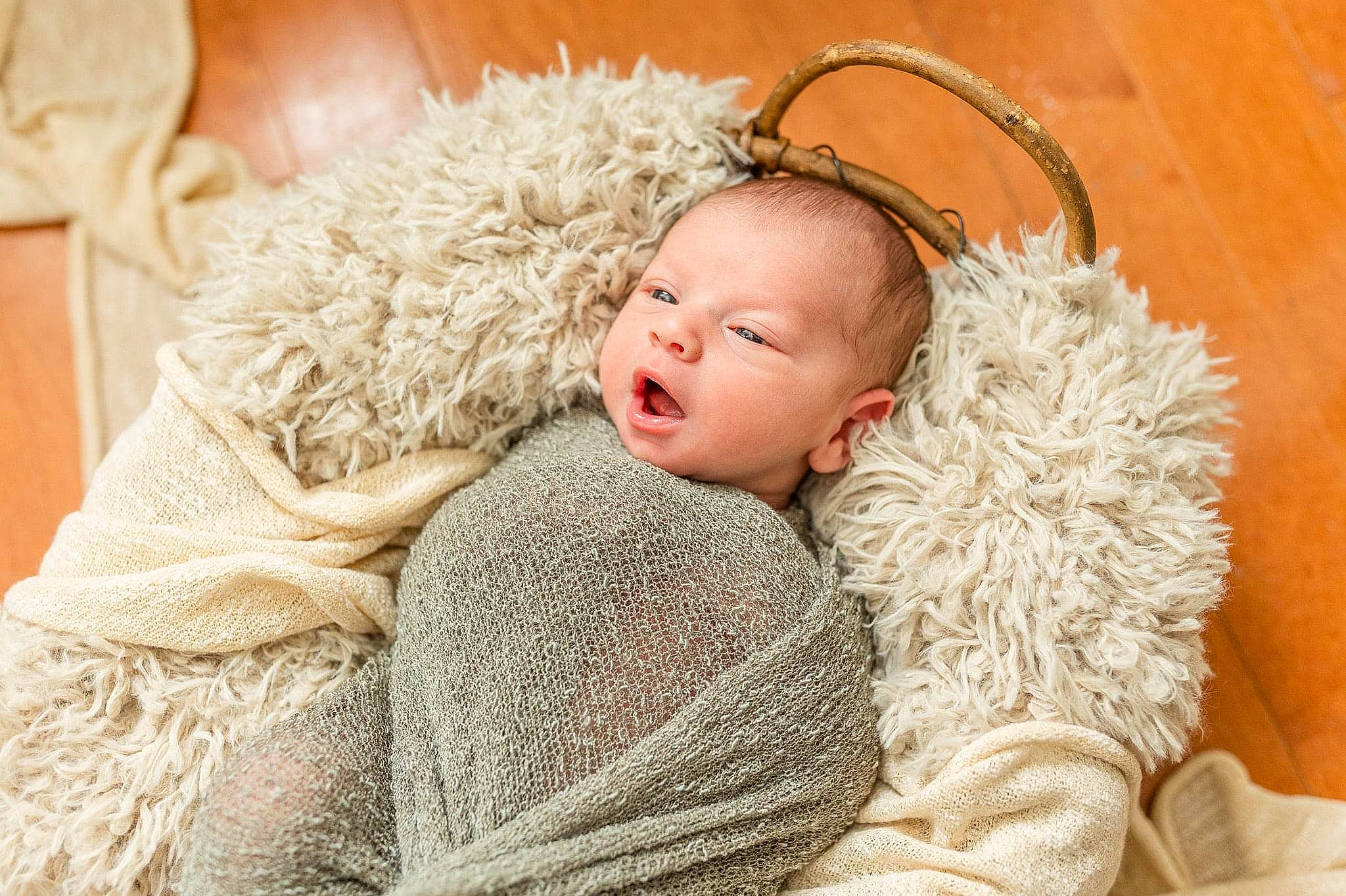Bennett is registered to the contest to win money with this photo: audio_accessory, baby, baby_toddler_clothing, blanket, comfort, fur, fur_clothing, gadget, hearing, human, natural_material, person, sleep, toddler, wool, woolen